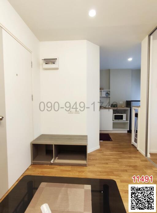 Modern apartment interior view showing hallway and kitchen