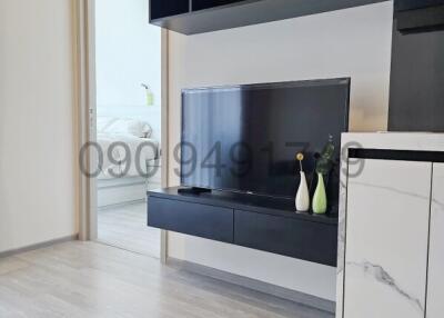 Modern living room with sleek entertainment unit and stylish decor