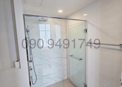 Modern bathroom with glass shower and clean white design