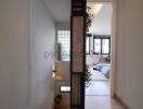 Modern home interior with a view into a stylish bedroom through an ornate metal partition