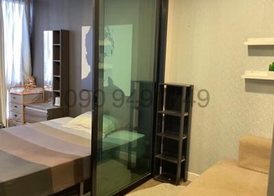 Modern bedroom with sliding glass door and elegant design