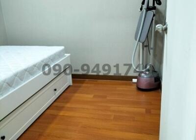 Small minimalist bedroom with wooden flooring