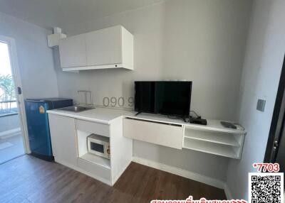Compact living room with integrated kitchen area
