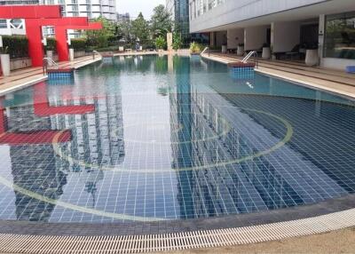 Outdoor swimming pool with modern design in residential complex