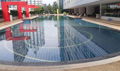 Outdoor swimming pool with modern design in residential complex