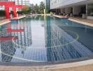 Outdoor swimming pool with modern design in residential complex