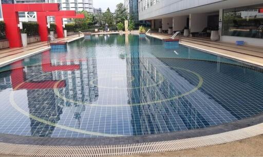 Outdoor swimming pool with modern design in residential complex