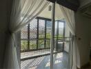 Bright and spacious balcony with privacy screen and sliding doors