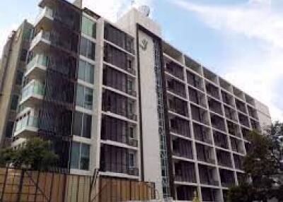 Exterior view of a modern multi-story residential building with balconies