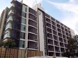 Exterior view of a modern multi-story residential building with balconies