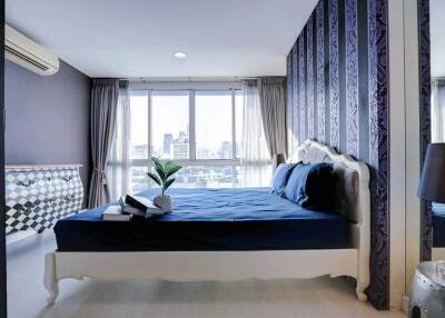 Elegant bedroom with modern design and city view