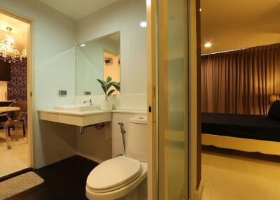 Modern bathroom adjacent to bedroom