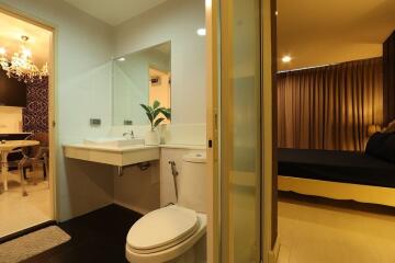 Modern bathroom adjacent to bedroom