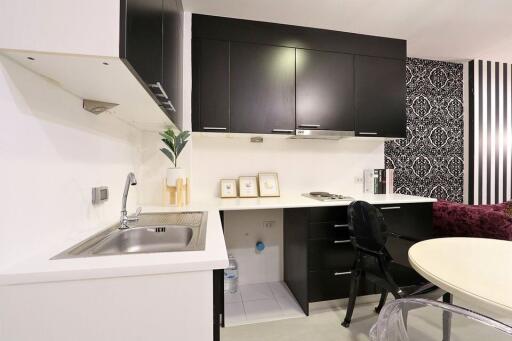 Modern kitchen with black cabinets and elegant design