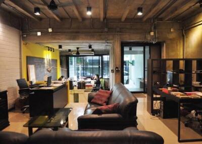 Modern industrial office space with open layout and stylish furniture
