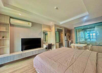 Spacious modern bedroom with integrated living area