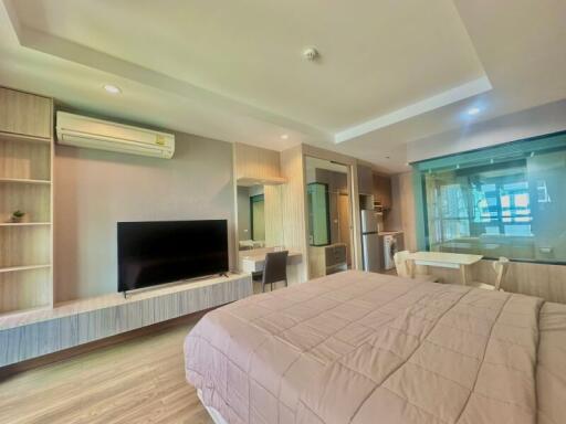 Spacious modern bedroom with integrated living area