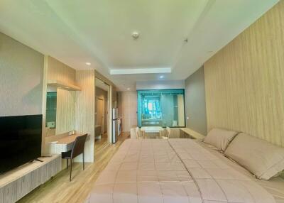 Spacious bedroom with integrated living area and modern design