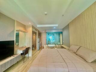 Spacious bedroom with integrated living area and modern design