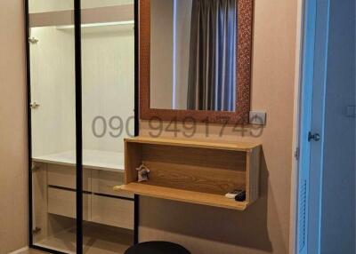 Modern bedroom interior with large mirror and wardrobe