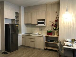 Modern kitchen with sleek cabinetry and integrated appliances