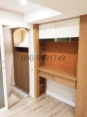 Modern hallway with built-in wooden storage cabinets