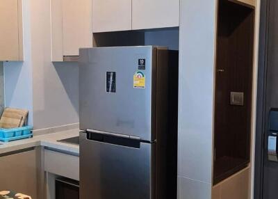 Modern kitchen with stainless steel appliances and white cabinetry