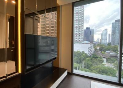 Modern living room with large windows offering a city view