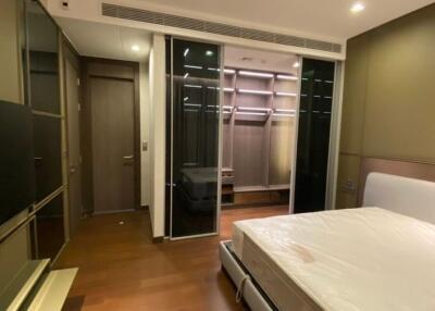 Modern bedroom interior with built-in wardrobe and ambient lighting