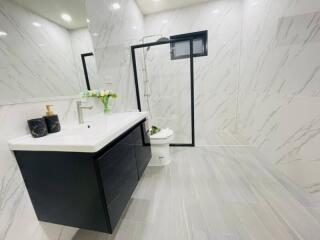 Modern bathroom with marble finish and elegant fixtures