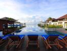 Luxurious infinity pool with ocean view flanked by lounging chairs