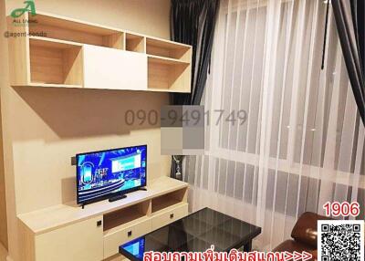 Modern and cozy living room interior with a large television and stylish shelving units