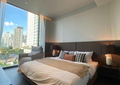 Modern bedroom with city view and natural light