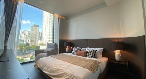 Modern bedroom with city view and natural light