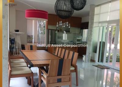 Modern spacious kitchen with dining area and large windows