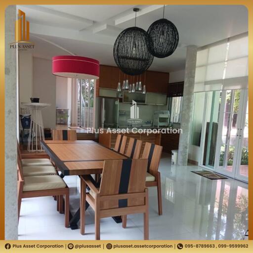 Modern spacious kitchen with dining area and large windows