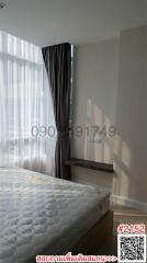 Contemporary bedroom with large window and natural light