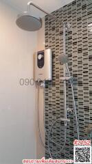 Modern bathroom with wall-mounted shower system and mosaic tiles