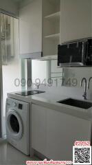 Modern kitchen with built-in appliances and white cabinetry