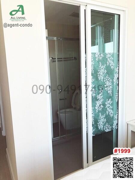 Modern bathroom with sliding door and decorative shower curtain