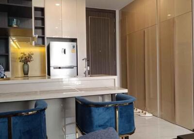 Modern kitchen with breakfast bar and stylish blue stools