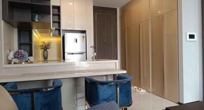 Modern kitchen with breakfast bar and stylish blue stools