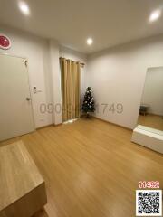 Spacious and well-lit living room with Christmas decoration