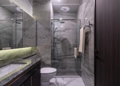 Modern bathroom with marble walls and stylish fixtures