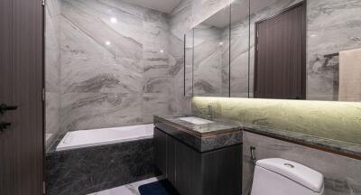 Modern bathroom with marble walls and elegant fixtures