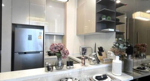 Modern kitchen with stainless steel appliances and elegant decor