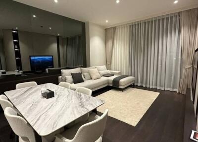 Modern living room with dining area and elegant furnishings