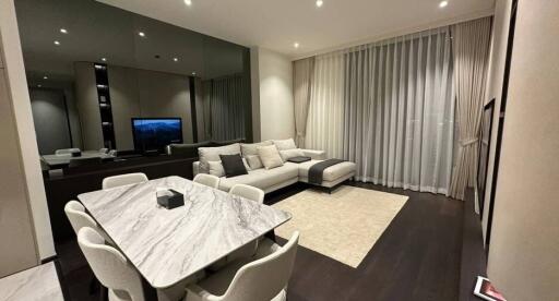 Modern living room with dining area and elegant furnishings