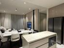 Modern kitchen and dining area with integrated appliances and stylish furnishings