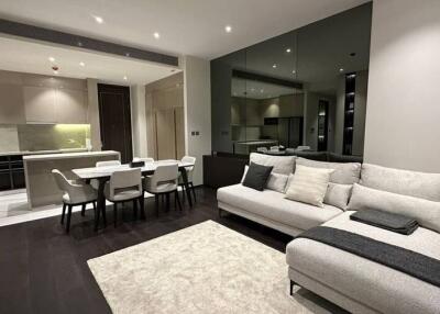 Modern open plan living room with integrated dining area and kitchen